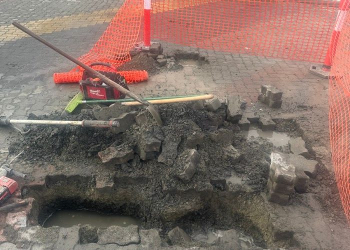 commercial plumbing pipe being dug up